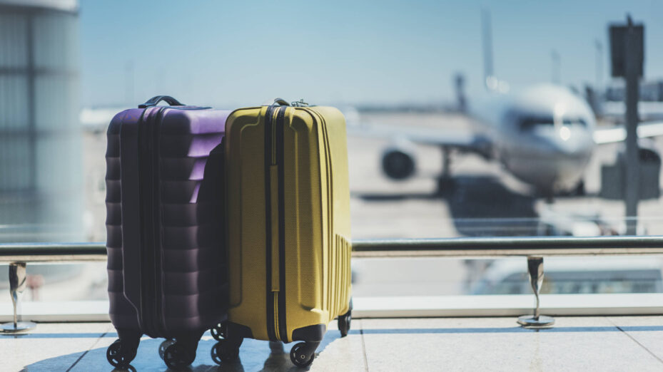 Suitcases,In,Airport,Departure,Lounge,,Airplane,In,Background,,Summer,Vacation
