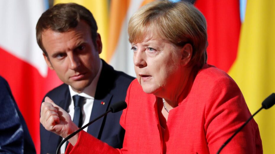Macron and Merkel attend a news conference following talks on EU integration, defence and migration in Paris