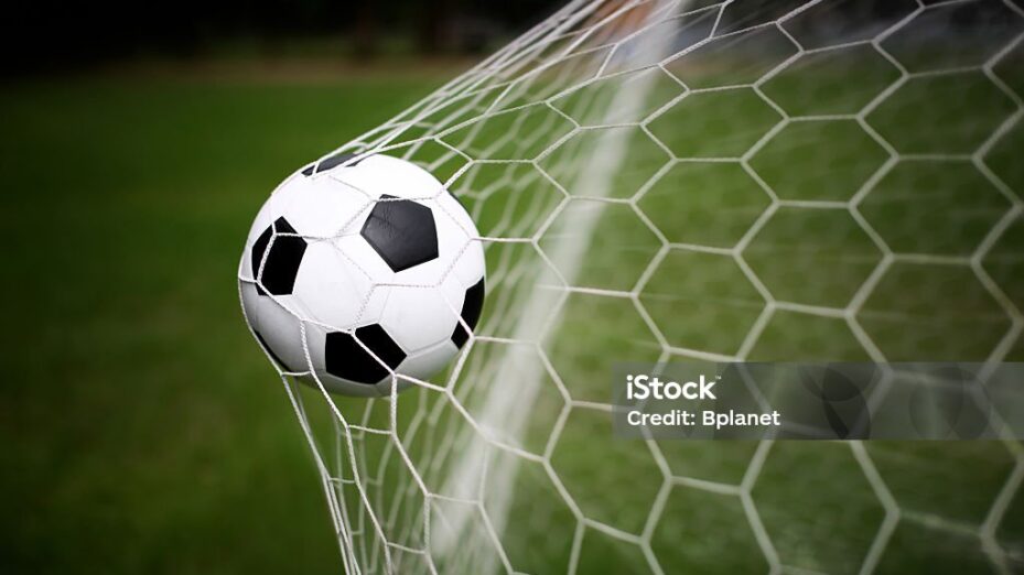 soccer ball in goal net